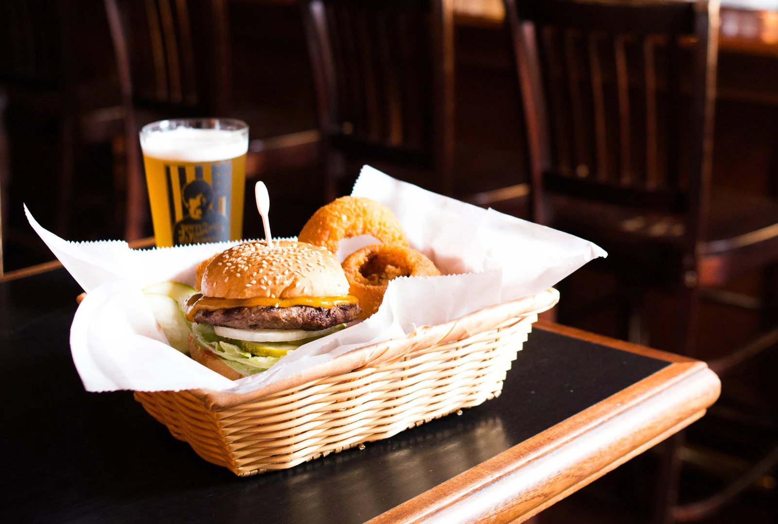 Cheeseburger with onion rings in a basket at Dotty Dumpling's Dowry in Madison