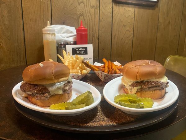 Double cheeseburgers with fries at Village Green in Middleton