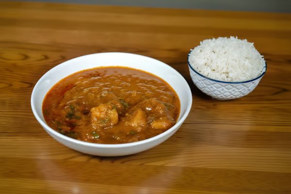 Curry bowl with a side of basmati rice at Grand Haveli Indian restaurant in Verona