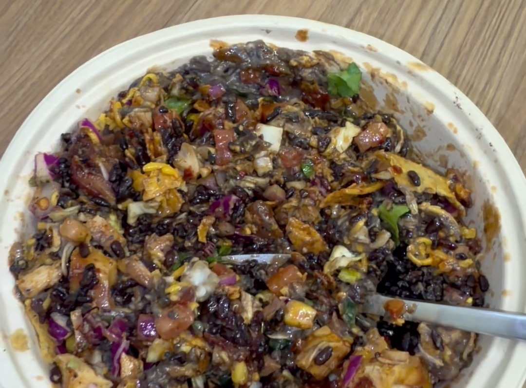 Mixed Fiesta Bowl with organic black rice, black beans, cabbage slaw, cheddar, and tortilla strips at Forage Kitchen