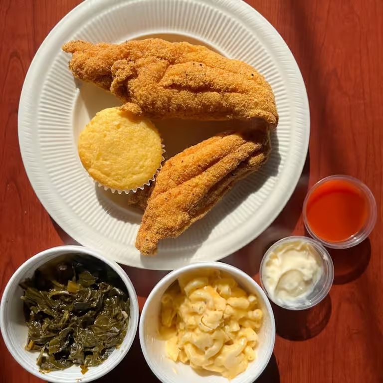 Fried fish plate with cornbread, collard greens, and mac and cheese from Marie's Soul Food on Monroe Street in Madison