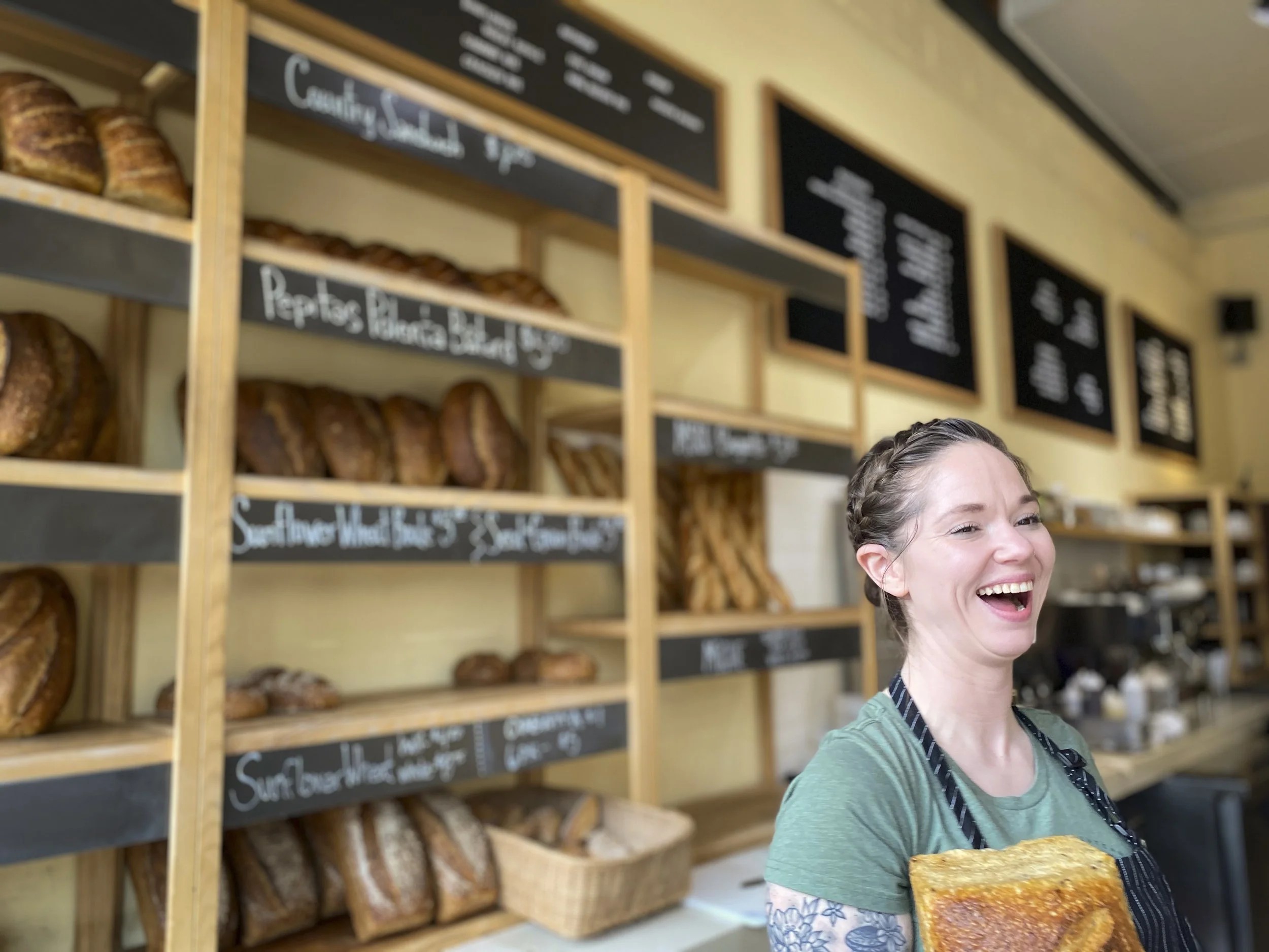 Inside Madison Sourdough on Willy Street with shelves of fresh sourdough loaves in Madison, Wisconsin